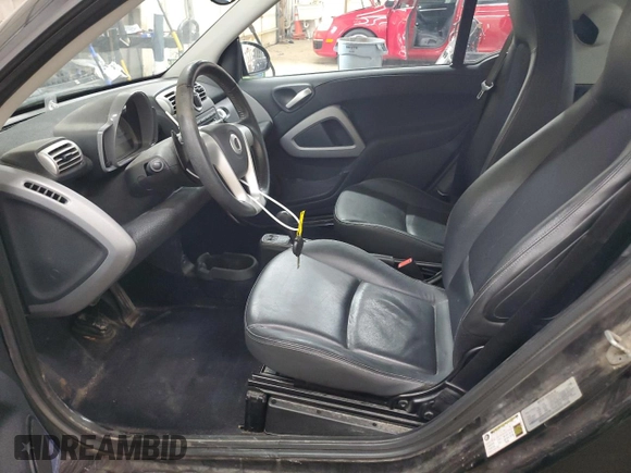 2009 Smart fortwo Pure z VIN WMEEJ31X99K209790, wystawiony jako Copart lot #51102685 z przebiegiem 30 389 mil mil oraz Szkody całkowita. Historia ofert i sprzedaży dostępna na DreamBid. Obrazek 7.