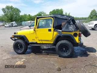 2005 Jeep Wrangler Sport z VIN 1J4FA49S65P381798, wystawiony jako IAAI lot #42305109 z przebiegiem 71 880 mil mil oraz . Historia ofert i sprzedaży dostępna na DreamBid. Obrazek 14.