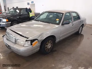 2005 Ford Crown Victoria LX with VIN 2FAFP74W95X158705, listed as a IAAI auction lot 41593553 with 276,940 mi miles. Bid and sale history available at carsss.com. Image 2.