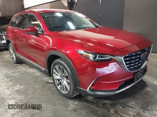 2023 Mazda CX-9 Signature z VIN JM3TCBEY4P0634153, wystawiony jako IAAI lot #42132856 z przebiegiem 25 131 mil mil oraz . Historia ofert i sprzedaży dostępna na DreamBid. Obrazek 1.