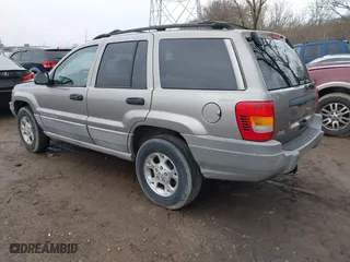 1999 Jeep Grand Cherokee Laredo with VIN 1J4GW58N0XC748809, listed as a IAAI auction lot 41722910 with 201,407 mi miles. Bid and sale history available at carsss.com. Image 3.