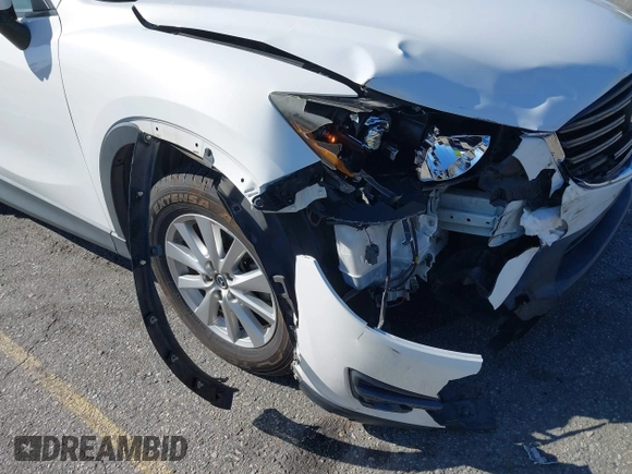 2016 Mazda CX-5 Sport with VIN JM3KE2BY9G0879654, listed as a IAAI auction lot 41819154 with 65,586 mi miles. Bid and sale history available at carsss.com. Image 6.