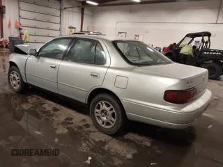 1995 Toyota Camry LE with VIN 4T1GK12E5SU080734, listed as a IAAI auction lot 41738102 with 211,559 mi miles. Bid and sale history available at carsss.com. Image 3.