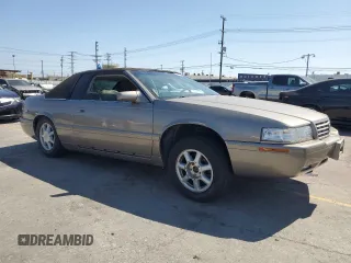 2002 Cadillac Eldorado Touring ETC z VIN 1G6ET12952B101866, wystawiony jako Copart lot #57365965 z przebiegiem Nie podano mil oraz Tytuł czysty. Historia ofert i sprzedaży dostępna na DreamBid. Obrazek 4.