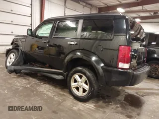 2007 Dodge Nitro SXT with VIN 1D8GU28K67W663621, listed as a IAAI auction lot 41691529 with 211,556 mi miles. Bid and sale history available at carsss.com. Image 3.