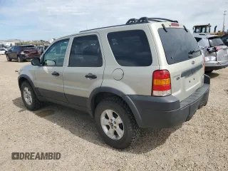 2005 Ford Escape XLT with VIN 1FMYU03165KC03784, listed as a Copart auction lot 64299225 with 185,033 mi miles and Salvage title. Bid and sale history available at DreamBid. Image 2.