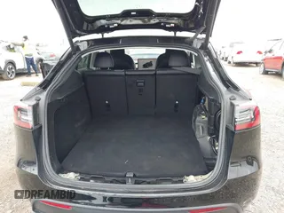 2023 Tesla Model Y Long Range z VIN 7SAYGDEEXPA181114, wystawiony jako IAAI lot #41564617 z przebiegiem 64 990 mil mil oraz . Historia ofert i sprzedaży dostępna na DreamBid. Obrazek 21.