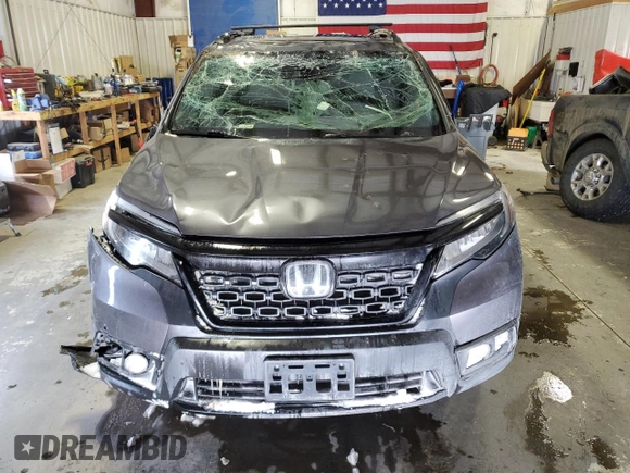2021 Honda Passport Elite z VIN 5FNYF8H05MB021597, wystawiony jako Copart lot #44463515 z przebiegiem Nie podano mil oraz Szkoda całkowita • Salvage title. Historia ofert i sprzedaży dostępna na DreamBid. Obrazek 5.