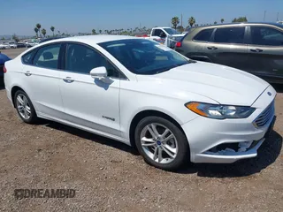 2018 Ford Fusion SE z VIN 3FA6P0LU2JR261268, wystawiony jako IAAI lot #42301578 z przebiegiem 63 357 mil mil oraz . Historia ofert i sprzedaży dostępna na DreamBid. Obrazek 1.