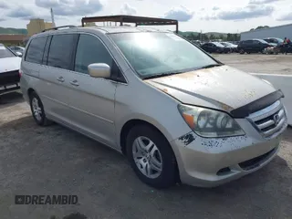 2005 Honda Odyssey EX-L with VIN 5FNRL38745B126338, listed as a IAAI auction lot 41991119 with 165,552 mi miles. Bid and sale history available at carsss.com. Image 1.