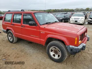 1999 Jeep Cherokee Sport with VIN 1J4FT68S2XL580915, listed as a Copart auction lot 50374875 with 286,276 mi miles and Salvage Title. Bid and sale history available at carsss.com. Image 4.