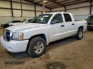 2007 Dodge Dakota SLT with VIN 1D7HW48K97S141569, listed as a Copart auction lot 84002054 with 204,019 mi miles and Salvage Title. Bid and sale history available at carsss.com. Image 1.