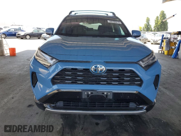 2022 Toyota RAV4 Hybrid SE with VIN 4T3T6RFV7NU103423, listed as a Copart auction lot 59709215 with 27,595 mi miles and Salvage title. Bid and sale history available at DreamBid. Image 5.