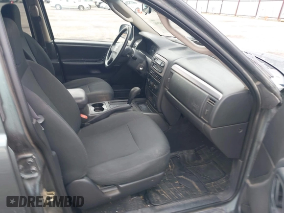 2003 Jeep Grand Cherokee Laredo with VIN 1J4GX48S03C536709, listed as a IAAI auction lot 41908946 with 240,435 mi miles. Bid and sale history available at carsss.com. Image 5.