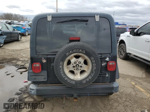 2002 Jeep Wrangler Sahara z VIN 1J4FA59S42P776905, wystawiony jako Copart lot #53373015 z przebiegiem 231 915 mil mil oraz Czysty tytuł • Clean title. Historia ofert i sprzedaży dostępna na DreamBid. Obrazek 6.