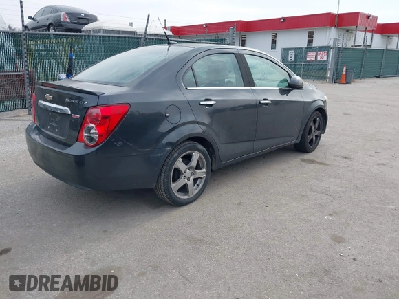 2014 Chevrolet Sonic LTZ with VIN 1G1JE5SB1E4200234, listed as a IAAI auction lot 41850396 with 173,324 mi miles. Bid and sale history available at carsss.com. Image 4.