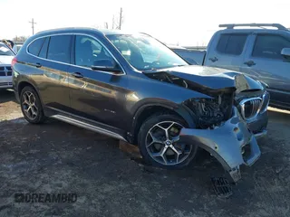 2017 BMW X1 sDrive28i with VIN WBXHU7C30H5H32753, listed as a IAAI auction lot 41441791 with 100,072 mi miles. Bid and sale history available at carsss.com. Image 1.