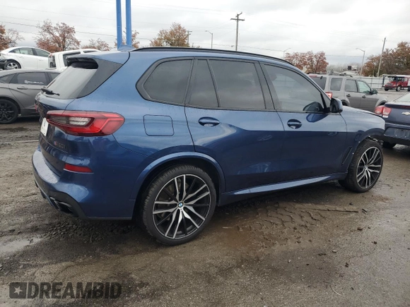 2020 BMW X5 M50i with VIN 5UXJU4C07LLE46002, listed as a Copart auction lot 77853984 with 74,098 mi miles and Salvage Title. Bid and sale history available at DreamBid. Image 3.