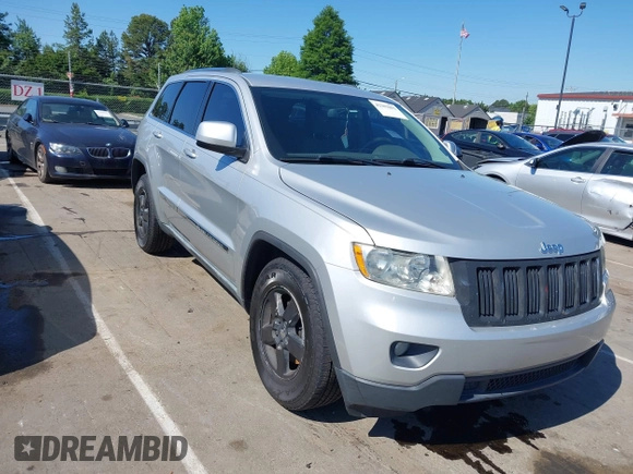 2011 Jeep Grand Cherokee Laredo with VIN 1J4RS4GGXBC513523, listed as a IAAI auction lot 42203802 with 242,239 mi miles and . Bid and sale history available at DreamBid. Image 1.