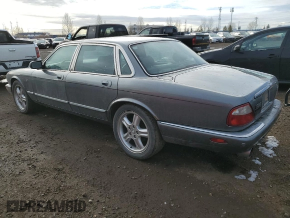 2002 Jaguar XJ with VIN SAJFA12C72LF47096, listed as a Copart auction lot 79412794 with 287,060 mi miles and Clean Title. Bid and sale history available at DreamBid. Image 2.