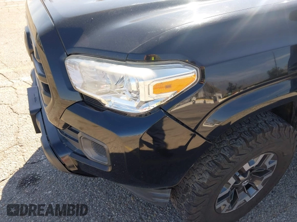 2018 Toyota Tacoma SR with VIN 3TMCZ5AN2JM127244, listed as a IAAI auction lot 41698199 with 61,535 mi miles and . Bid and sale history available at DreamBid. Image 6.