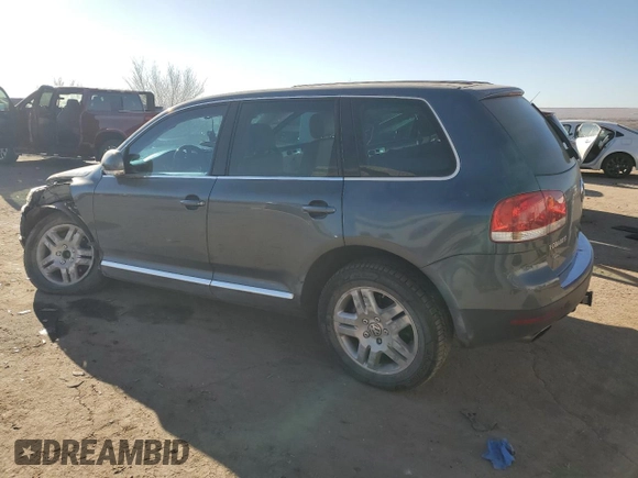 2004 Volkswagen Touareg z VIN WVGEM77L64D051760, wystawiony jako Copart lot #87044304 z przebiegiem Nie podano mil oraz Szkoda całkowita • Salvage title. Historia ofert i sprzedaży dostępna na DreamBid. Obrazek 2.