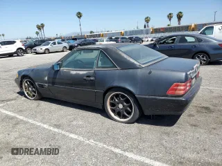1992 Mercedes-Benz 500 z VIN WDBFA66E9NF050217, wystawiony jako Copart lot #58065965 z przebiegiem 143 456 mil mil oraz Tytuł czysty. Historia ofert i sprzedaży dostępna na DreamBid. Obrazek 2.