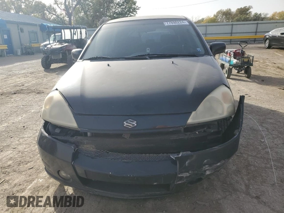 2003 Suzuki Aerio SX z VIN JS2RC41H135205642, wystawiony jako Copart lot #77690224 z przebiegiem 161 414 mil mil oraz Szkoda całkowita • Salvage title. Historia ofert i sprzedaży dostępna na DreamBid. Obrazek 5.