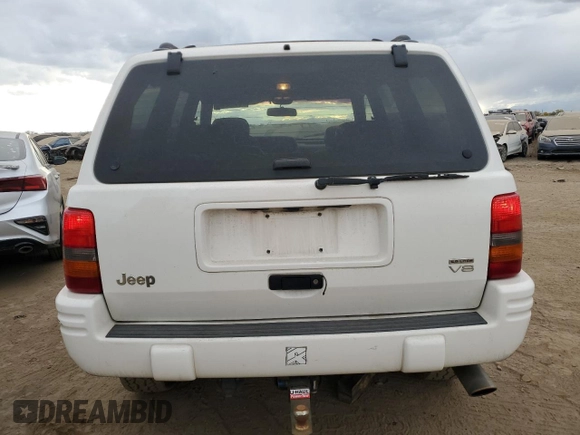 1998 Jeep Grand Cherokee Limited with VIN 1J4GZ88Z4WC164505, listed as a Copart auction lot 76843304 with 0 mi miles and Salvage Title. Bid and sale history available at carsss.com. Image 6.