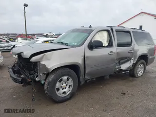 2009 Chevrolet Suburban LT w/2LT with VIN 1GNFC26J39R236980, listed as a IAAI auction lot 41721772 with 215,684 mi miles. Bid and sale history available at carsss.com. Image 2.