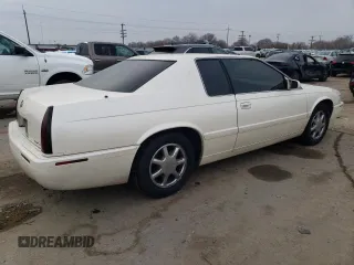 2001 Cadillac Eldorado Touring ETC z VIN 1G6ET12921B103685, wystawiony jako Copart lot #84565144 z przebiegiem 99 265 mil mil oraz Szkoda całkowita • Salvage title. Historia ofert i sprzedaży dostępna na DreamBid. Obrazek 3.