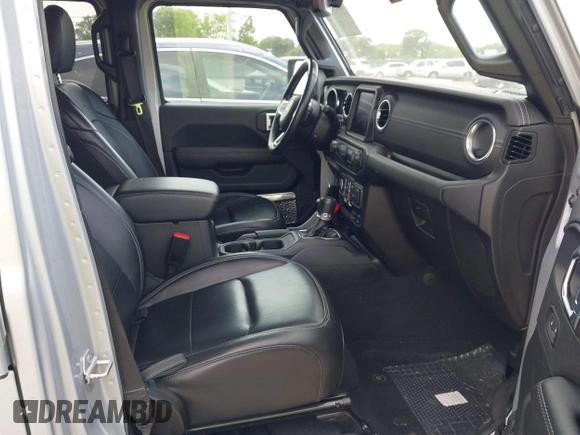2023 Jeep Wrangler Sahara with VIN 1C4JJXP62PW627455, listed as a IAAI auction lot 42115137 with 62,143 mi miles and . Bid and sale history available at DreamBid. Image 5.