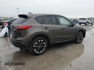2016 Mazda CX-5 Grand Touring with VIN JM3KE2DY4G0811386, listed as a Copart auction lot 51961795 with 99,525 mi miles and Salvage Title. Bid and sale history available at carsss.com. Image 3.
