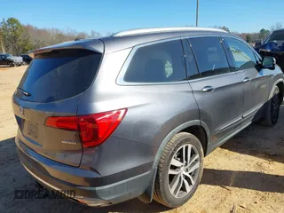2017 Honda Pilot Touring with VIN 5FNYF5H92HB038893, listed as a IAAI auction lot 41639555 with 100,354 mi miles. Bid and sale history available at carsss.com. Image 4.