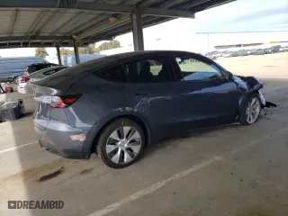 2023 Tesla Model Y Long Range with VIN 7SAYGDEEXPA137582, listed as a Copart auction lot 46869265 with 16,474 mi miles and Salvage Title. Bid and sale history available at carsss.com. Image 3.