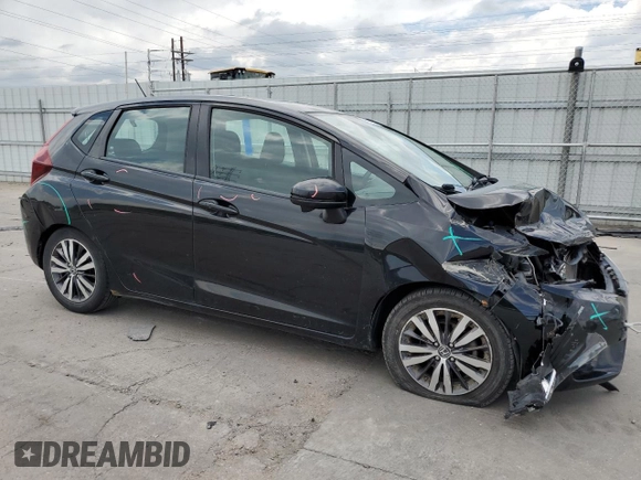 2015 Honda Fit EX-L z VIN 3HGGK5H80FM704920, wystawiony jako Copart lot #59834245 z przebiegiem 86 415 mil mil oraz Szkoda całkowita • Salvage title. Historia ofert i sprzedaży dostępna na DreamBid. Obrazek 4.