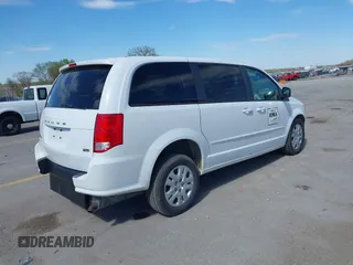 2014 Dodge Grand Caravan American Value with VIN 2C4RDGBG8ER140342, listed as a IAAI auction lot 42198306 with 135,564 mi miles and . Bid and sale history available at DreamBid. Image 4.