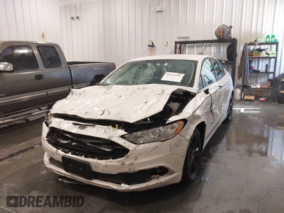2018 Ford Fusion SE z VIN 3FA6P0HD9JR231970, wystawiony jako IAAI lot #41549490 z przebiegiem 99 803 mil mil oraz . Historia ofert i sprzedaży dostępna na DreamBid. Obrazek 6.