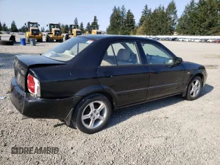2003 Mazda Protege DX with VIN JM1BJ226231214537, listed as a Copart auction lot 54448615 with 147,753 mi miles and Salvage Title. Bid and sale history available at DreamBid. Image 3.