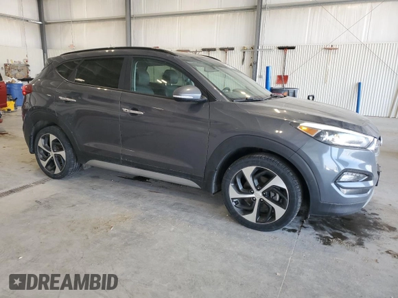 2017 Hyundai Tucson Sport with VIN KM8J3CA20HU594697, listed as a Copart auction lot 54252355 with 98,696 mi miles and Salvage Title. Bid and sale history available at DreamBid. Image 4.