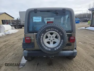 2004 Jeep Wrangler Sahara with VIN 1J4FA59S64P774768, listed as a Copart auction lot 49868895 with 120,800 mi miles and Salvage Title. Bid and sale history available at DreamBid. Image 6.