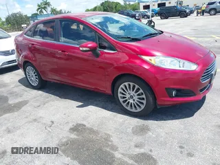 2015 Ford Fiesta SEL z VIN 3FADP4CJ0FM115010, wystawiony jako IAAI lot #42491187 z przebiegiem 116 529 mil mil oraz . Historia ofert i sprzedaży dostępna na DreamBid. Obrazek 1.