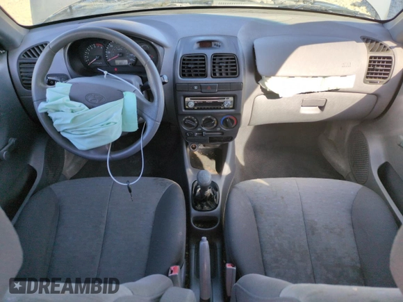 2004 Hyundai Accent GL with VIN KMHCG45C94U523529, listed as a Copart auction lot 50016085 with 188,120 mi miles and Salvage Title. Bid and sale history available at carsss.com. Image 8.