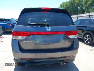 2015 Honda Odyssey Touring Elite z VIN 5FNRL5H99FB017517, wystawiony jako IAAI lot #42246066 z przebiegiem 104 878 mil mil oraz . Historia ofert i sprzedaży dostępna na DreamBid. Obrazek 6.