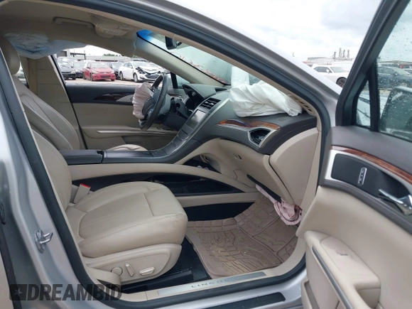 2016 Lincoln MKZ with VIN 3LN6L2G90GR631161, listed as a IAAI auction lot 42063610 with 63,336 mi miles. Bid and sale history available at carsss.com. Image 5.