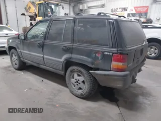 1995 Jeep Grand Cherokee Laredo with VIN 1J4GZ58S6SC765863, listed as a IAAI auction lot 41797726 with 234,715 mi miles and . Bid and sale history available at DreamBid. Image 3.