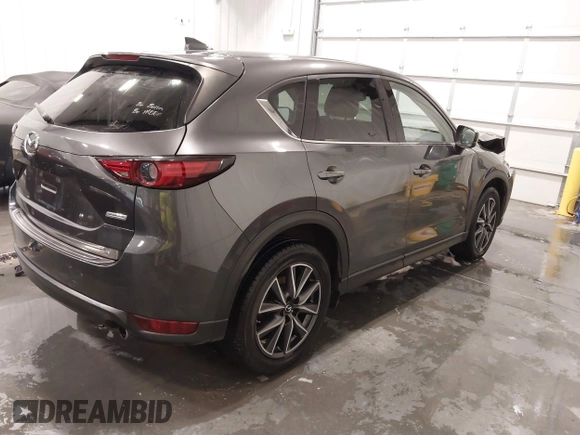 2017 Mazda CX-5 Grand Touring with VIN JM3KFADLXH0151593, listed as a IAAI auction lot 41823378 with 149,299 mi miles. Bid and sale history available at carsss.com. Image 4.