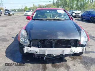 2005 Infiniti G35 Coupe with VIN JNKCV54E25M400142, listed as a IAAI auction lot 41937062 with 135,522 mi miles. Bid and sale history available at carsss.com. Image 12.