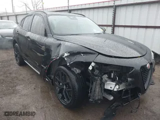2021 Alfa Romeo Stelvio Ti with VIN ZASPAKBN0M7D02795, listed as a IAAI auction lot 41052309 with 83,584 mi miles. Bid and sale history available at carsss.com. Image 1.