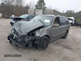 2005 Kia Sedona LX with VIN KNDUP132056674430, listed as a IAAI auction lot 41553321 with 136,734 mi miles. Bid and sale history available at carsss.com. Image 2.